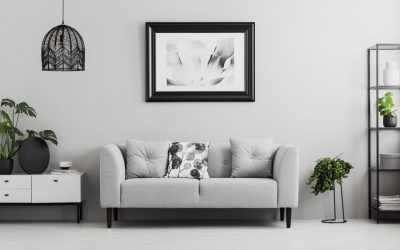 black-industrial-bookcase-and-a-plant-stand-next-to-an-upholster.jpg